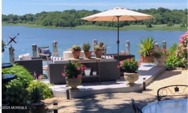 638 S Riverside Dr, Neptune Township, NJ 07753 - view of patio featuring a water view and a forest view