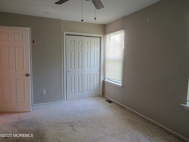 127 Meli Ln, Jackson, NJ 08527 - unfurnished bedroom with carpet flooring, a closet, baseboards, and ceiling fan