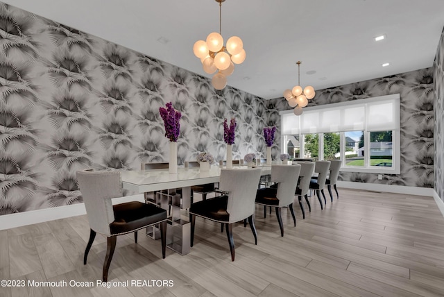 dining area featuring wallpapered walls, a chandelier, baseboards, wood finished floors, and recessed lighting