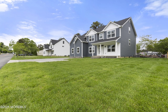 1808 2nd Ave, Toms River, NJ 08757 - view of front facade with covered porch, a front lawn, and board and batten siding