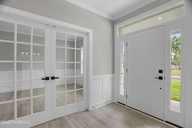 1808 2nd Ave, Toms River, NJ 08757 - entryway with french doors, wood finished floors, ornamental molding, healthy amount of natural light, and a decorative wall