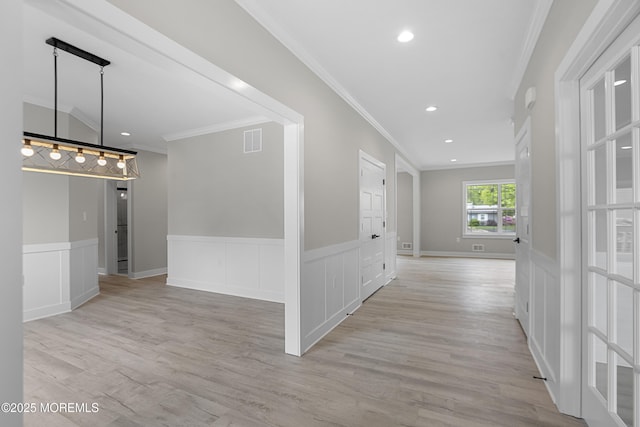 1808 2nd Ave, Toms River, NJ 08757 - hallway with crown molding, light wood-style floors, wainscoting, and a decorative wall