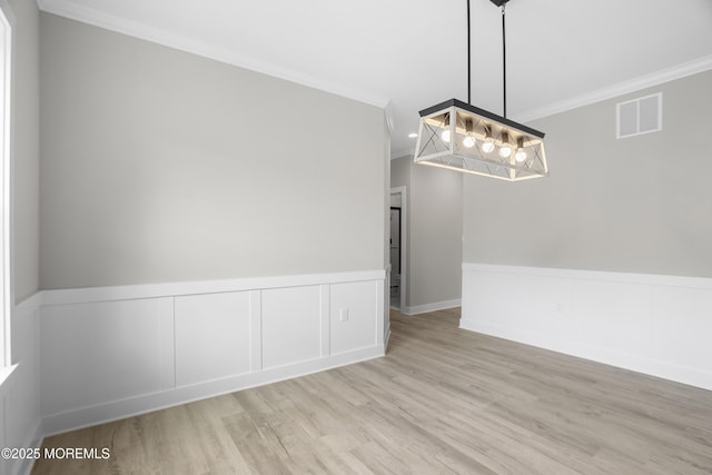 1808 2nd Ave, Toms River, NJ 08757 - unfurnished dining area featuring crown molding, wood finished floors, and a wainscoted wall