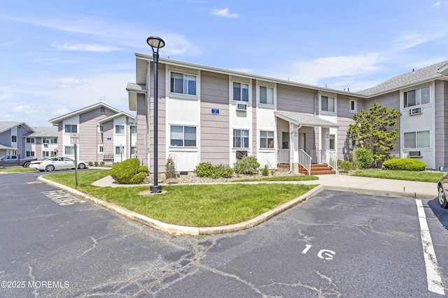 50 Valentine St Unit 14B, Monmouth Beach, NJ 07750 - view of building exterior with uncovered parking and a residential view