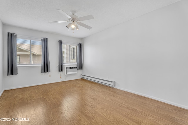 50 Valentine St Unit 14B, Monmouth Beach, NJ 07750 - unfurnished room with baseboard heating, wood finished floors, ceiling fan, and baseboards