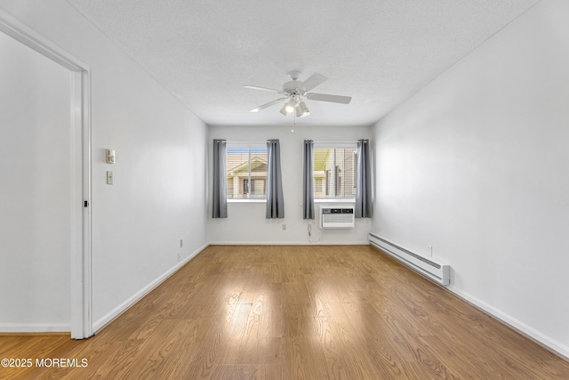50 Valentine St Unit 14B, Monmouth Beach, NJ 07750 - spare room featuring a baseboard radiator, ceiling fan, light wood-type flooring, a textured ceiling, and baseboards