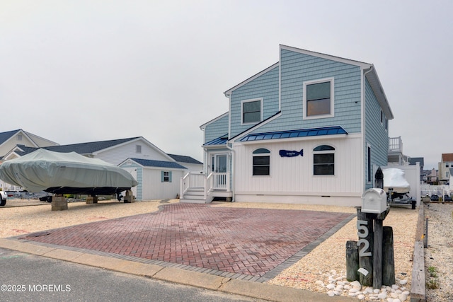 52 Benjamin Blvd, Manahawkin, NJ 08050 - view of front facade featuring a standing seam roof, crawl space, and metal roof