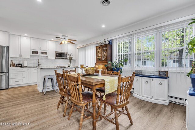 2 Oregon Dr Unit A, Whiting, NJ 08759 - dining space featuring a baseboard radiator, light wood-style flooring, ceiling fan, and recessed lighting