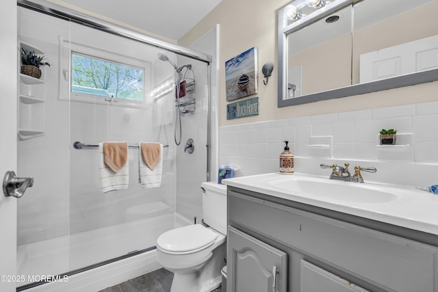 2 Oregon Dr Unit A, Whiting, NJ 08759 - bathroom featuring toilet, a stall shower, vanity, and tile walls