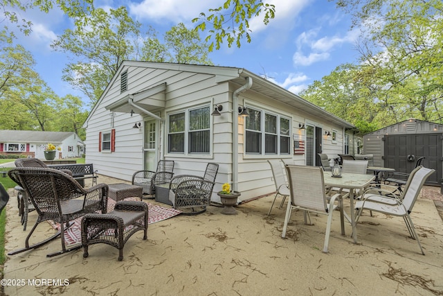 2 Oregon Dr Unit A, Whiting, NJ 08759 - rear view of property featuring outdoor lounge area, a storage unit, a patio area, an outbuilding, and outdoor dining space