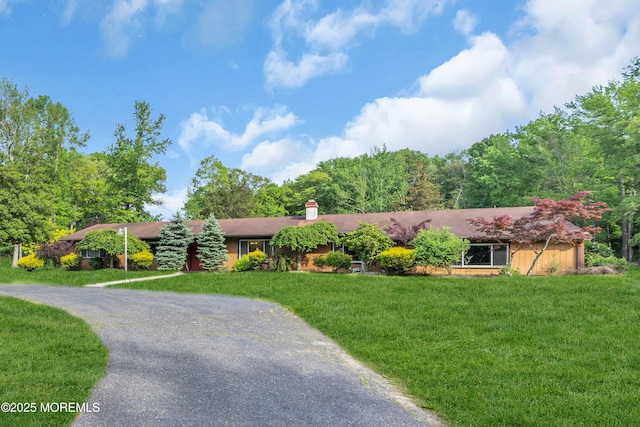 ranch-style house with a front yard