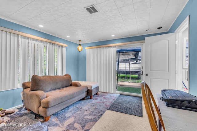 carpeted living room with recessed lighting
