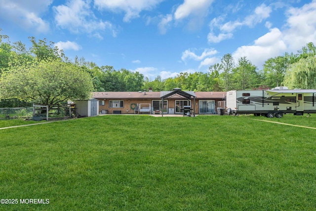 view of front of property with a storage unit and an outdoor structure