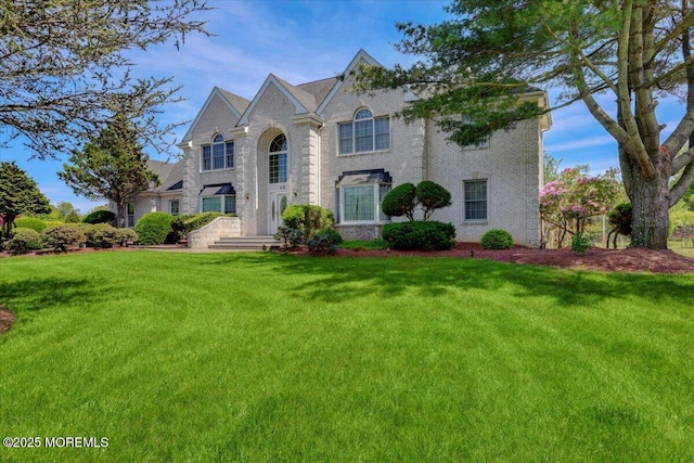 48 Joseph St, Manalapan, NJ 07726 - view of front of property featuring a front yard and brick siding