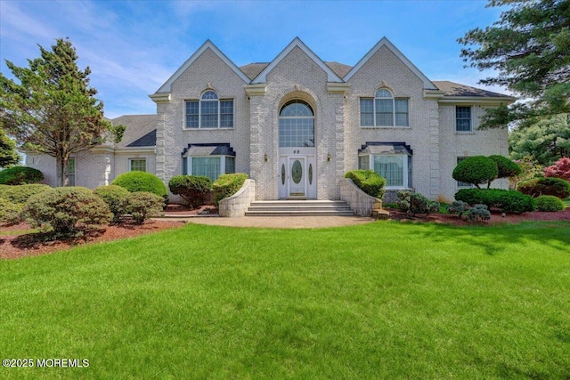 48 Joseph St, Manalapan, NJ 07726 - view of front of home featuring a front yard and brick siding