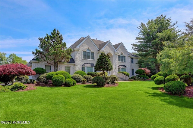 48 Joseph St, Manalapan, NJ 07726 - view of front of home with a front yard and brick siding