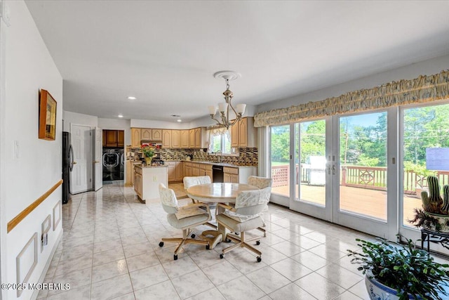 48 Joseph St, Manalapan, NJ 07726 - dining room featuring washer / dryer, a chandelier, recessed lighting, french doors, and light tile patterned floors