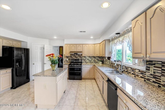 48 Joseph St, Manalapan, NJ 07726 - kitchen featuring a sink, black appliances, under cabinet range hood, a center island, and tasteful backsplash
