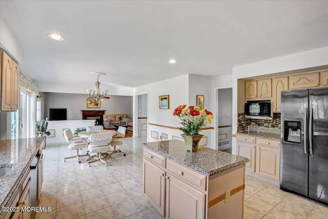 48 Joseph St, Manalapan, NJ 07726 - kitchen featuring black appliances, a chandelier, open floor plan, a center island, and light stone counters