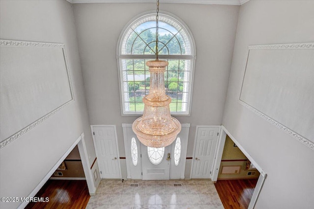 48 Joseph St, Manalapan, NJ 07726 - foyer with wood finished floors, baseboards, and a towering ceiling
