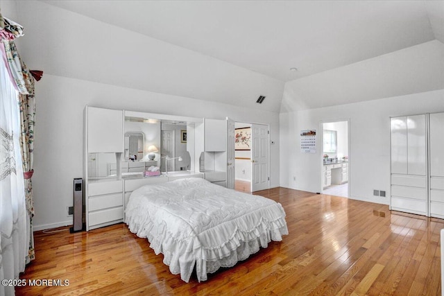 48 Joseph St, Manalapan, NJ 07726 - bedroom featuring lofted ceiling, light wood-style floors, connected bathroom, and baseboards