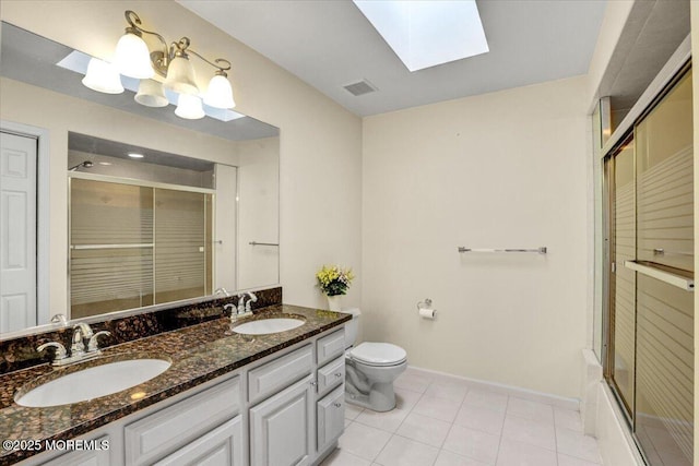 48 Joseph St, Manalapan, NJ 07726 - bathroom featuring a shower with door, a skylight, toilet, baseboards, and double vanity