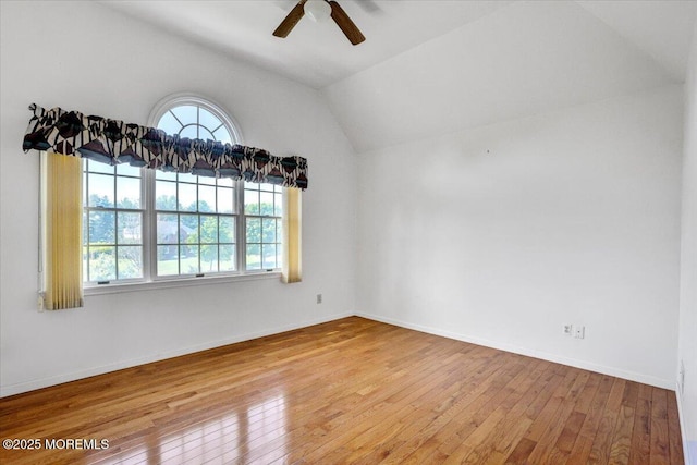 48 Joseph St, Manalapan, NJ 07726 - empty room featuring plenty of natural light, a ceiling fan, wood-type flooring, vaulted ceiling, and baseboards