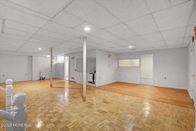48 Joseph St, Manalapan, NJ 07726 - finished below grade area with baseboards, recessed lighting, parquet flooring, and a paneled ceiling