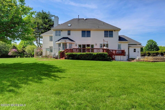 48 Joseph St, Manalapan, NJ 07726 - back of house with a deck and a chimney