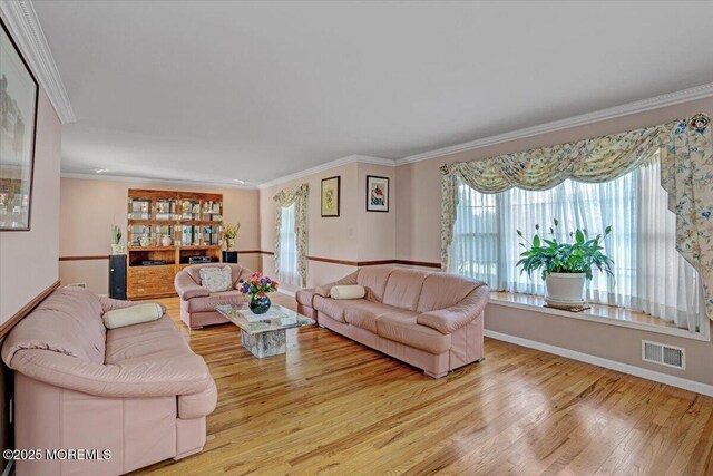 48 Joseph St, Manalapan, NJ 07726 - living room featuring wood finished floors, ornamental molding, and baseboards