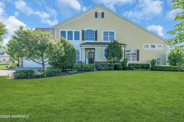 11 Aspen Ln, Tinton Falls, NJ 07724 - traditional home featuring a standing seam roof, a front yard, driveway, and metal roof