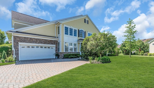 11 Aspen Ln, Tinton Falls, NJ 07724 - view of front of property with decorative driveway, a front yard, stone siding, and an attached garage