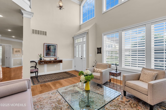 11 Aspen Ln, Tinton Falls, NJ 07724 - living room featuring ornamental molding, wood finished floors, and a towering ceiling