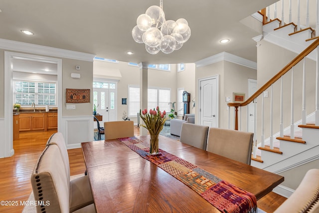 11 Aspen Ln, Tinton Falls, NJ 07724 - dining space with ornamental molding, stairway, light wood finished floors, a wainscoted wall, and recessed lighting