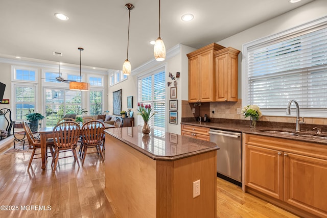 11 Aspen Ln, Tinton Falls, NJ 07724 - kitchen featuring stainless steel dishwasher, a sink, a kitchen island, light wood-type flooring, and dark stone counters