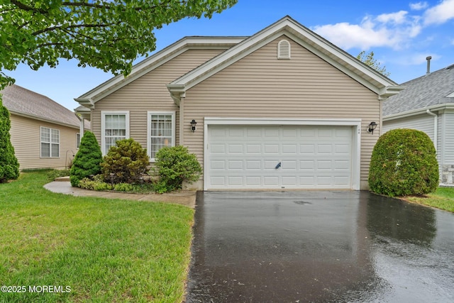 144 Sandpiper Rd, Barnegat, NJ 08005 - view of front of house with asphalt driveway, an attached garage, and a front yard