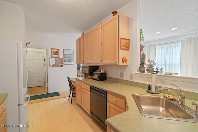 144 Sandpiper Rd, Barnegat, NJ 08005 - kitchen with dishwasher, freestanding refrigerator, a sink, light brown cabinetry, and a textured ceiling