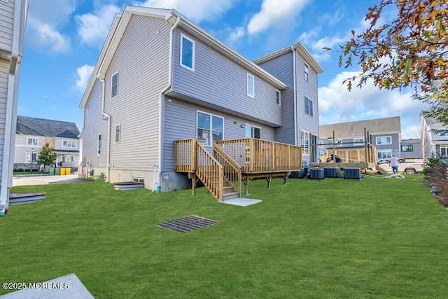 25 Blue River Way, Lakewood, NJ 08701 - rear view of property featuring a deck, a lawn, and central air condition unit