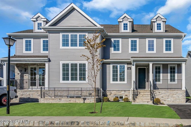 25 Blue River Way, Lakewood, NJ 08701 - view of front facade with a porch, a front yard, and roof with shingles
