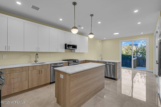 25 Blue River Way, Lakewood, NJ 08701 - kitchen with a sink, appliances with stainless steel finishes, light marble finish flooring, and recessed lighting