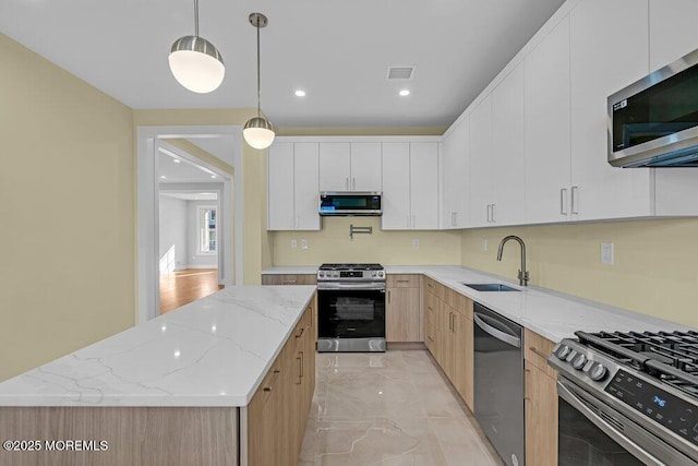 25 Blue River Way, Lakewood, NJ 08701 - kitchen featuring stainless steel appliances, a sink, light stone counters, light marble finish flooring, and pendant lighting