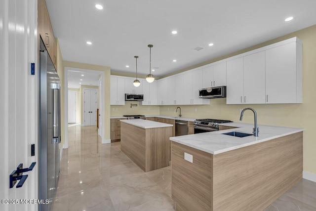 25 Blue River Way, Lakewood, NJ 08701 - kitchen with appliances with stainless steel finishes, a sink, light marble finish flooring, a center island, and recessed lighting