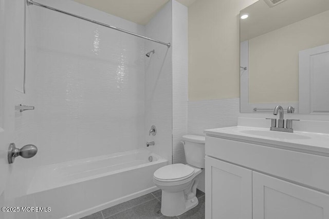 25 Blue River Way, Lakewood, NJ 08701 - bathroom featuring shower / bathtub combination, toilet, vanity, a wainscoted wall, and tile patterned flooring