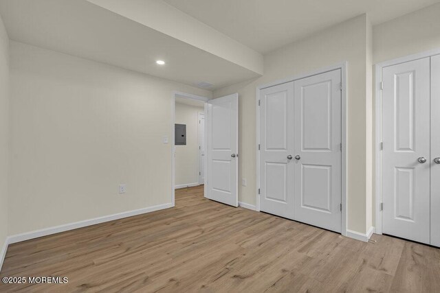 25 Blue River Way, Lakewood, NJ 08701 - unfurnished bedroom featuring electric panel, light wood-style floors, baseboards, recessed lighting, and a closet