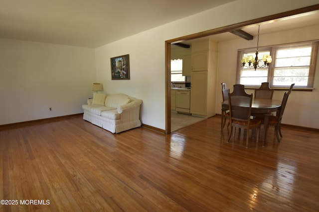 1595 Forge Pond Rd, Brick, NJ 08724 - living room with a chandelier, light wood-style flooring, and baseboards