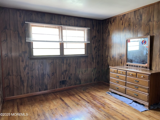 1595 Forge Pond Rd, Brick, NJ 08724 - bedroom featuring light wood-style floors and wood walls
