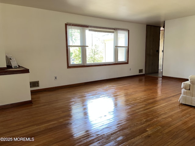 1595 Forge Pond Rd, Brick, NJ 08724 - unfurnished living room with wood finished floors and baseboards