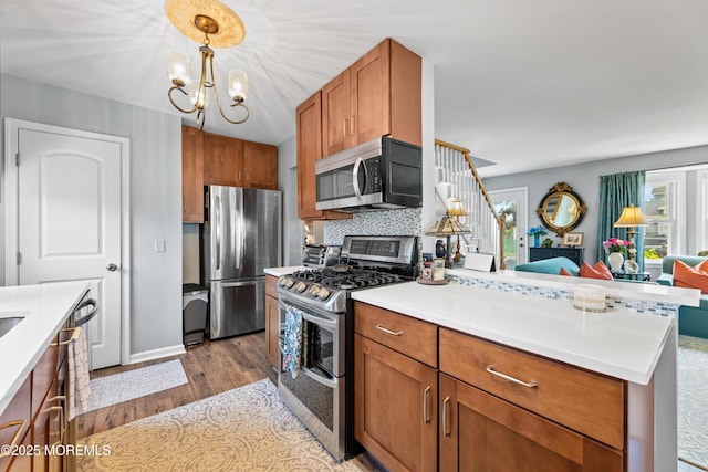 129 Foster Rd, Toms River, NJ 08753 - kitchen featuring stainless steel appliances, wood finished floors, healthy amount of natural light, and open floor plan