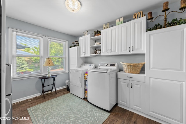 129 Foster Rd, Toms River, NJ 08753 - washroom with washer and clothes dryer, dark wood-type flooring, cabinet space, baseboards, and a chandelier