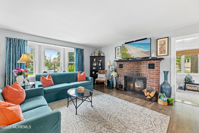 129 Foster Rd, Toms River, NJ 08753 - living area with wood-type flooring and a brick fireplace